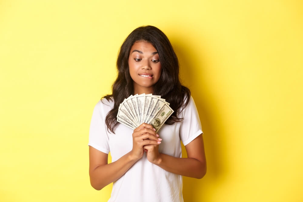 woman with cash from title loan