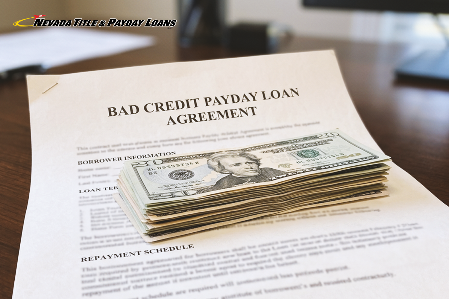 payday loan cash laying on a bad credit loan agreement