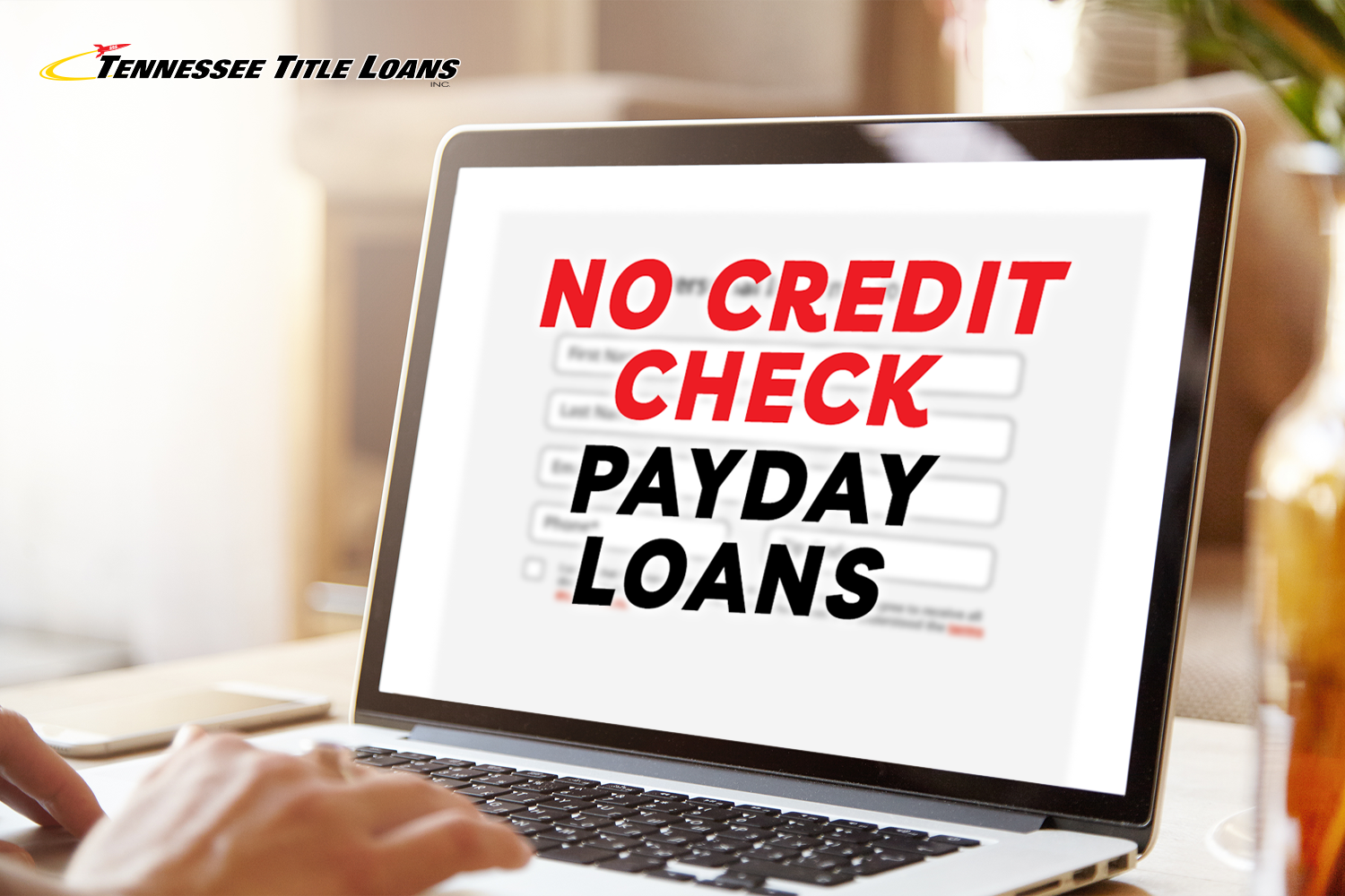 person in office researching no credit check payday loans online through Tennessee Title Loans, Inc.