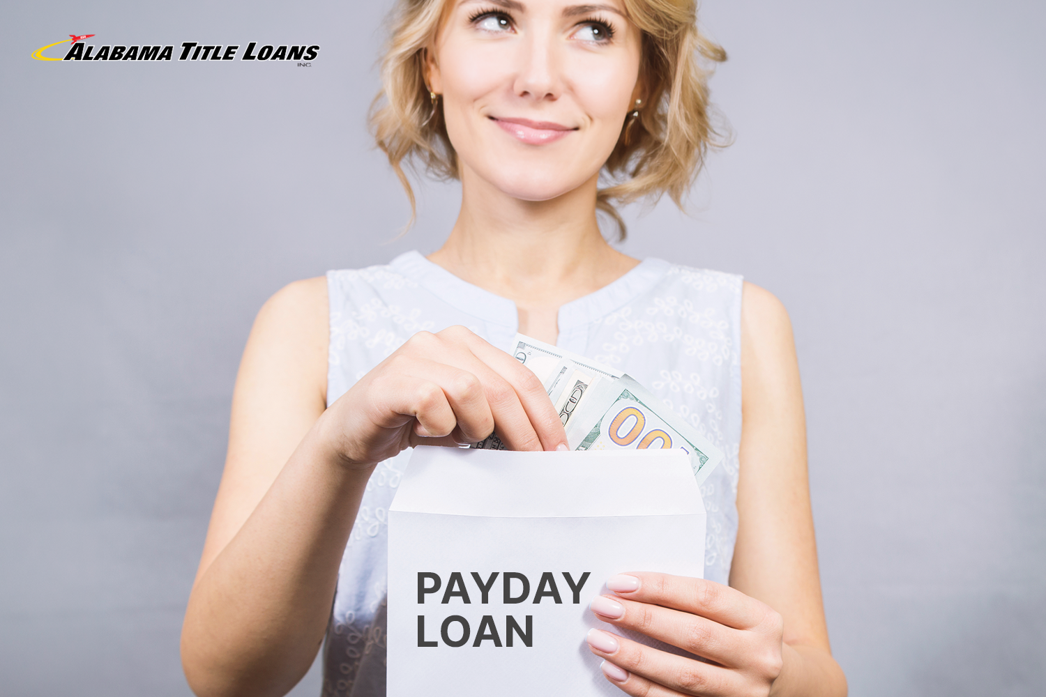 woman pulling money from a payday loan envelope