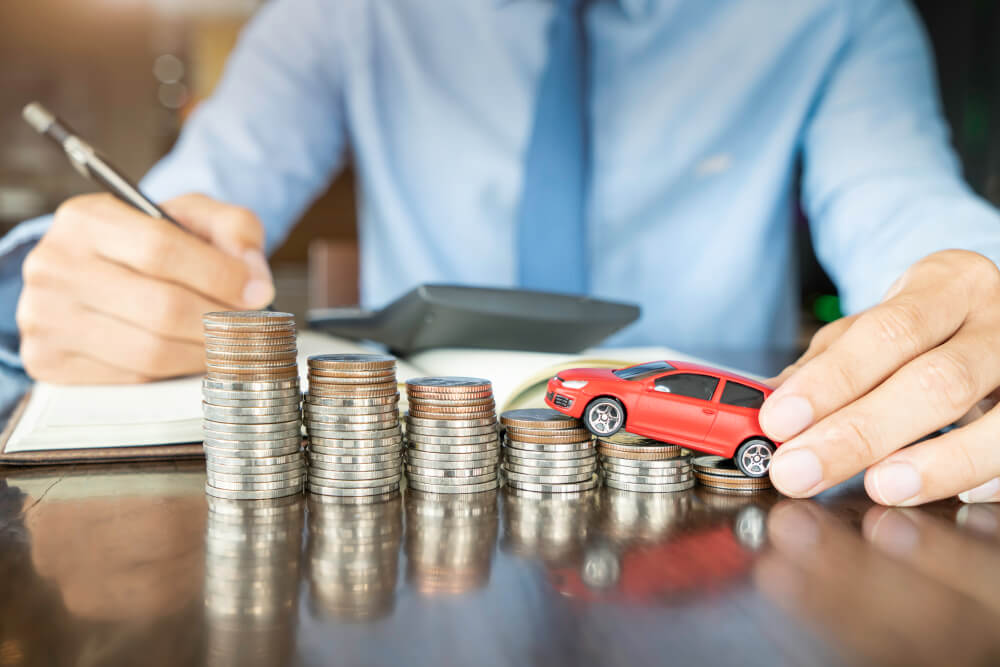 man with toy car and coins needing a wisconsin title loan