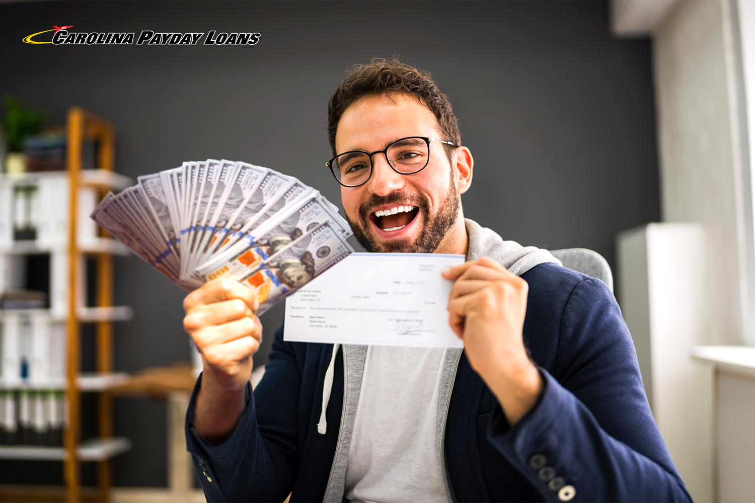 man holds low-income payday loan and check