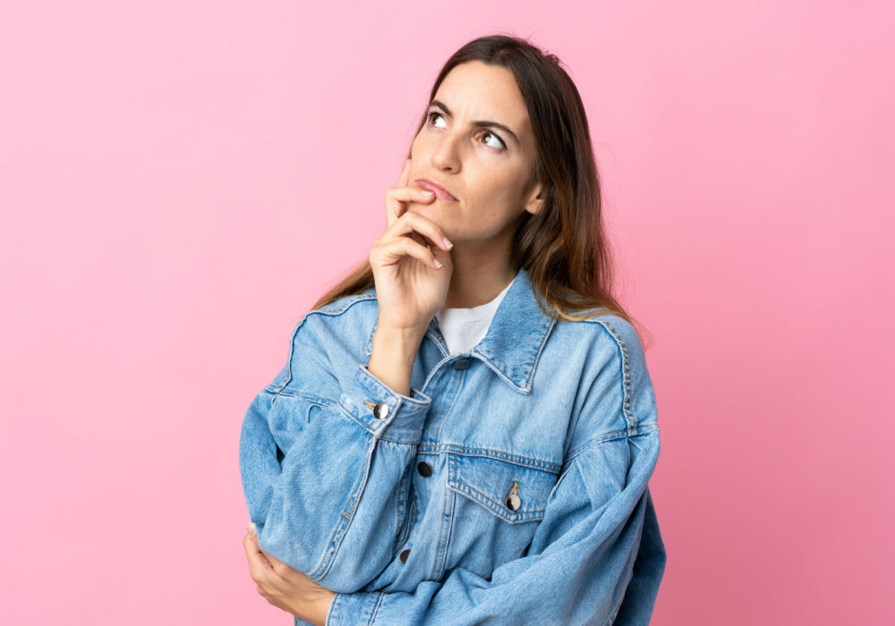 woman thinking about car title loan online