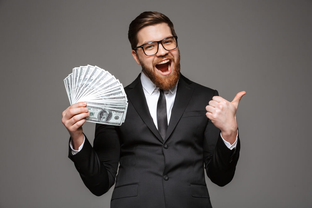 Man holding car title loan money