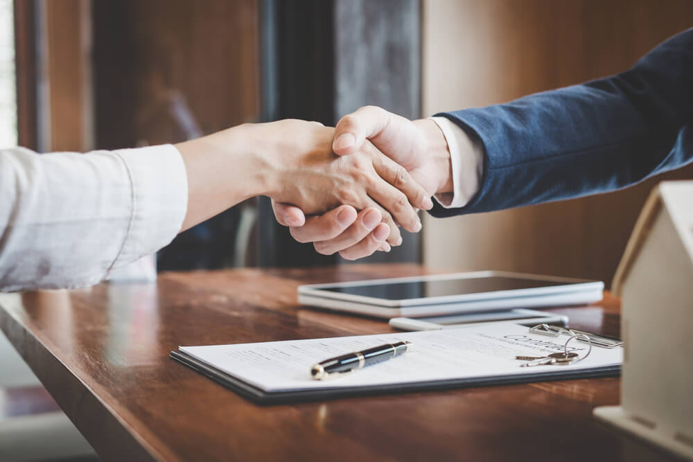 people shaking hands while getting an equity loans