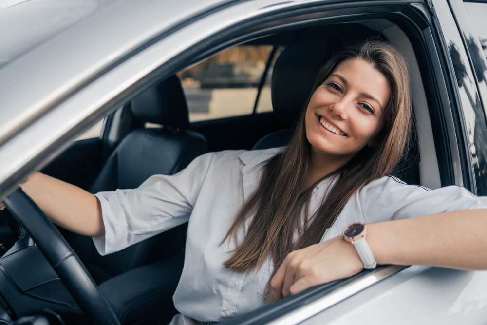 woman using car for title pawn