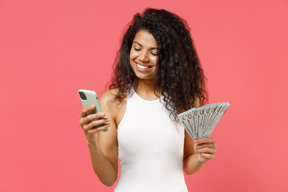 woman on phone with auto title pawn cash