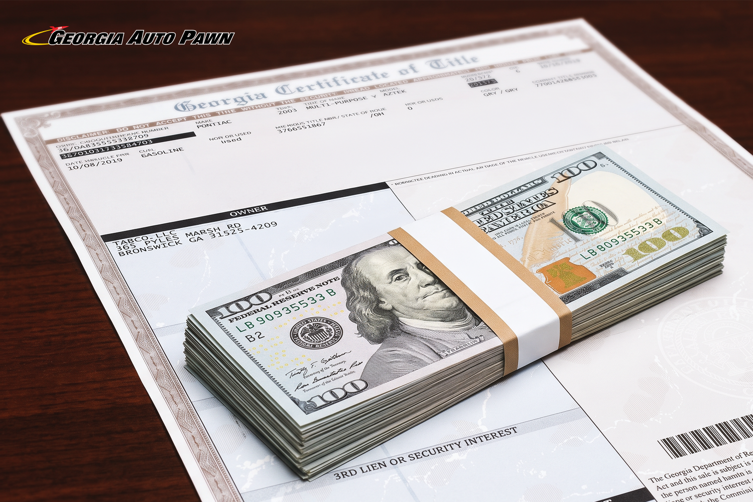 Stack of money on a Georgia vehicle title