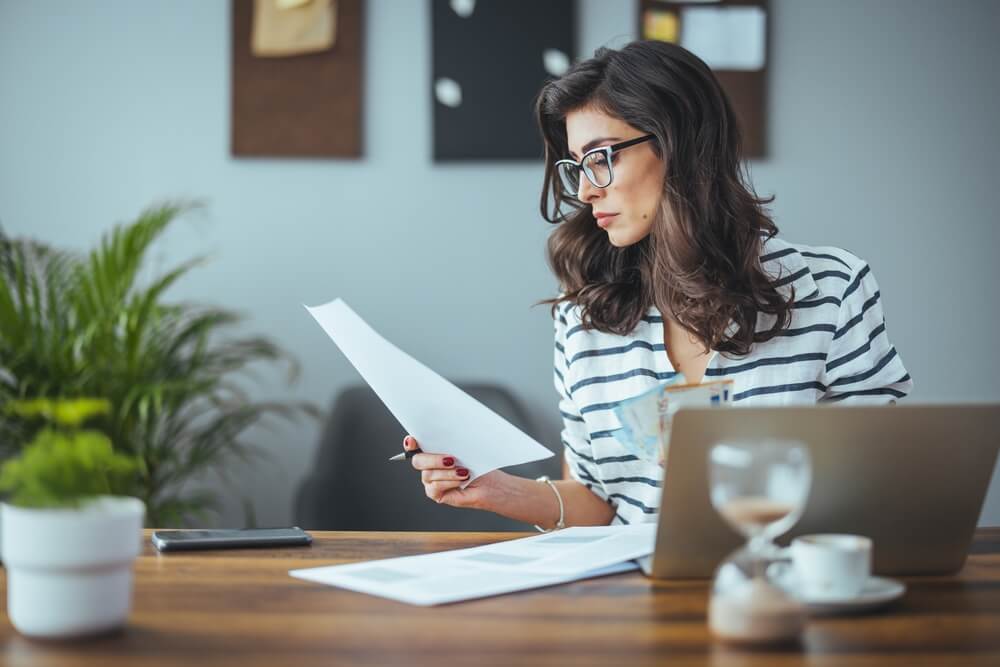 woman reading personal finance tips