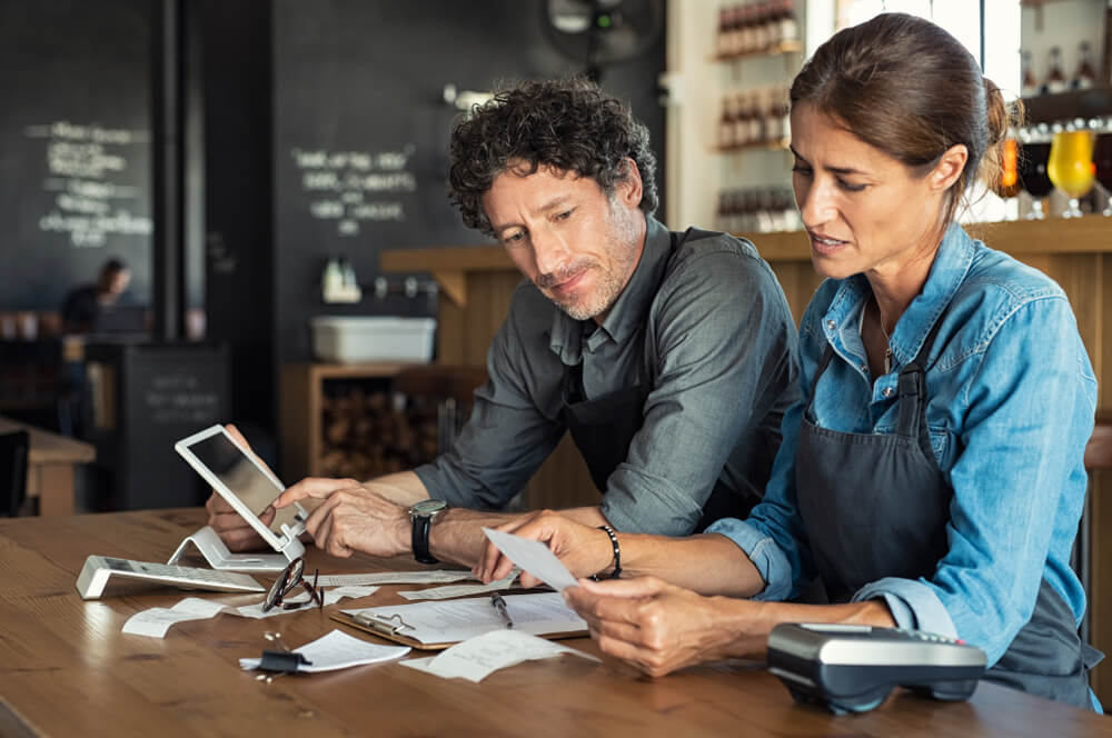 couple reviewing essential expenses