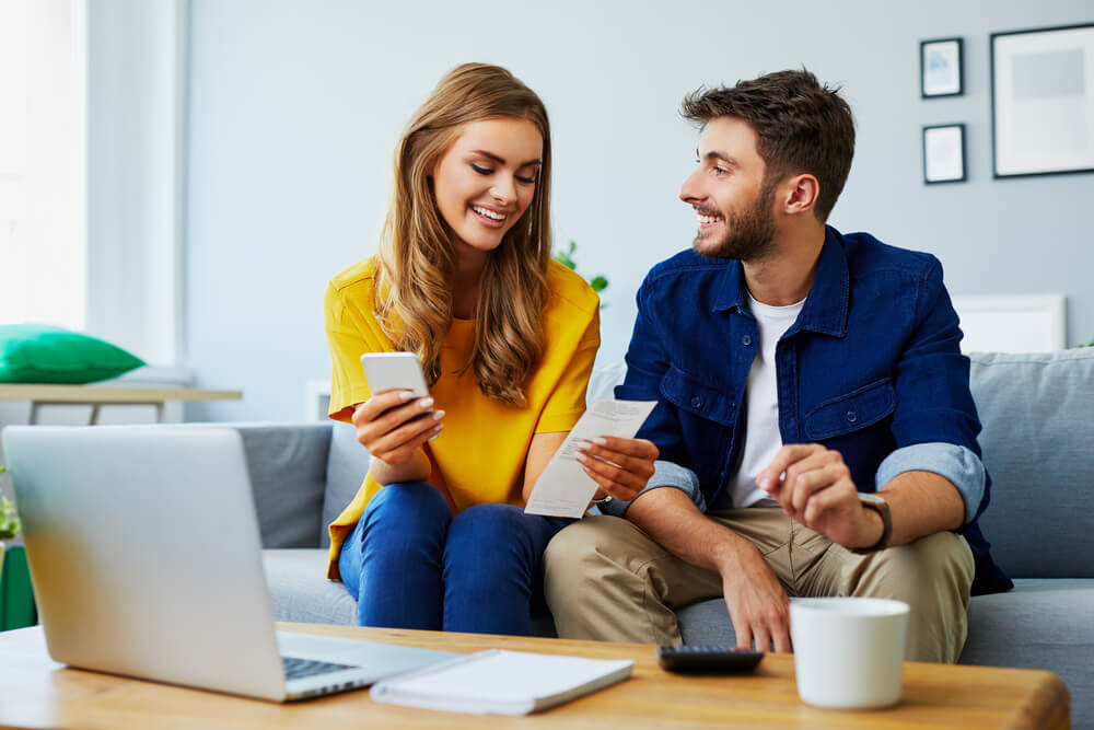 couple paying bills with a payday loan