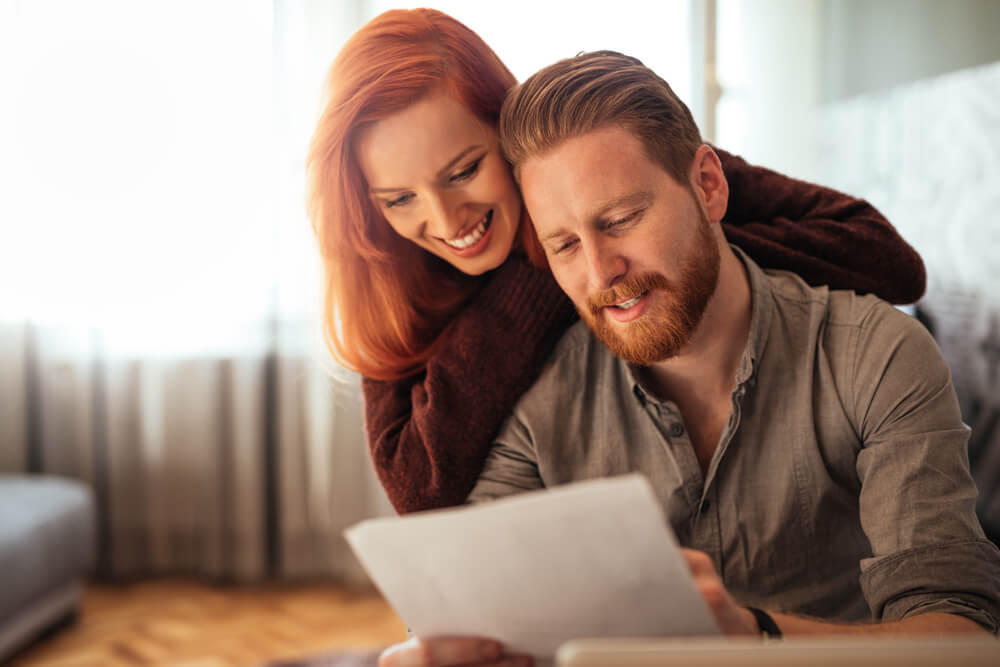 couple reviewing title loan application for fast cash