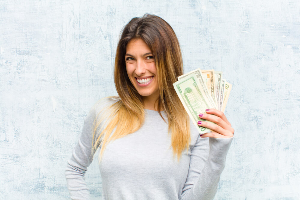 woman with payday loan cash