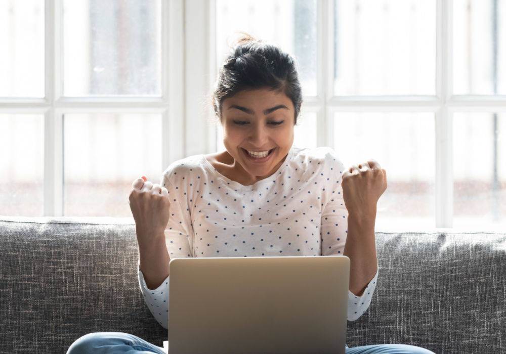 woman excited from getting car title loan money online