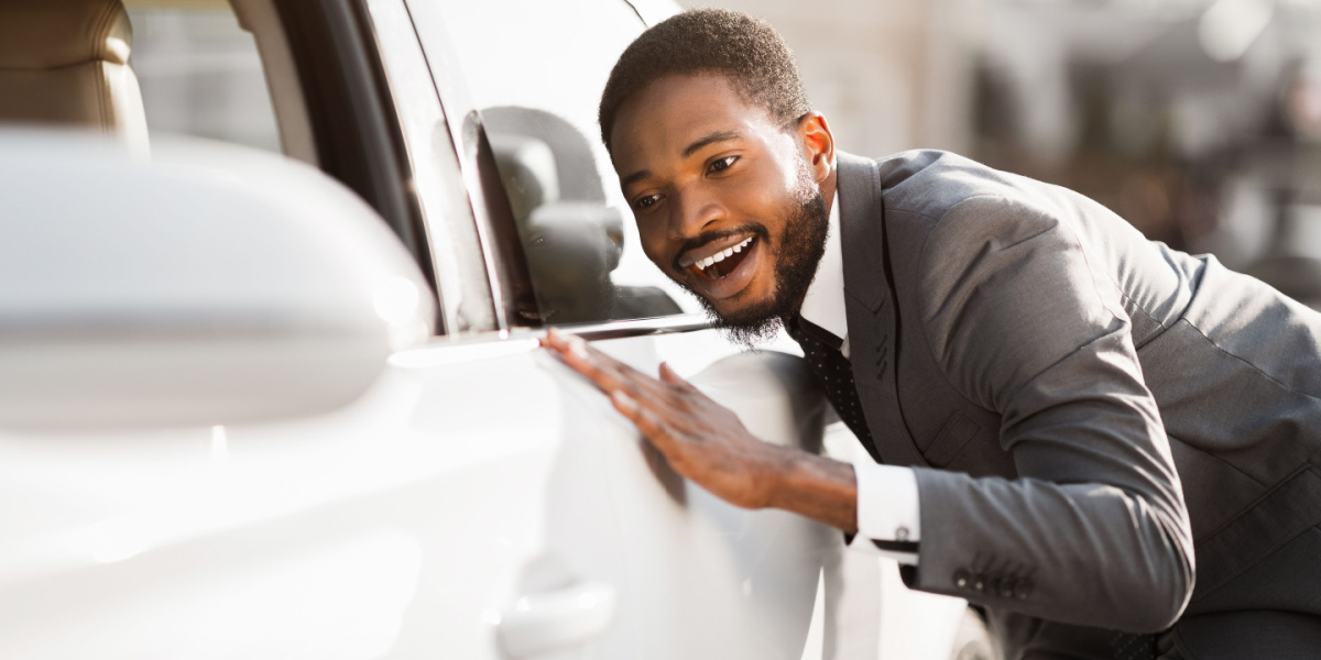 Title Loan Representative inspecting car at location