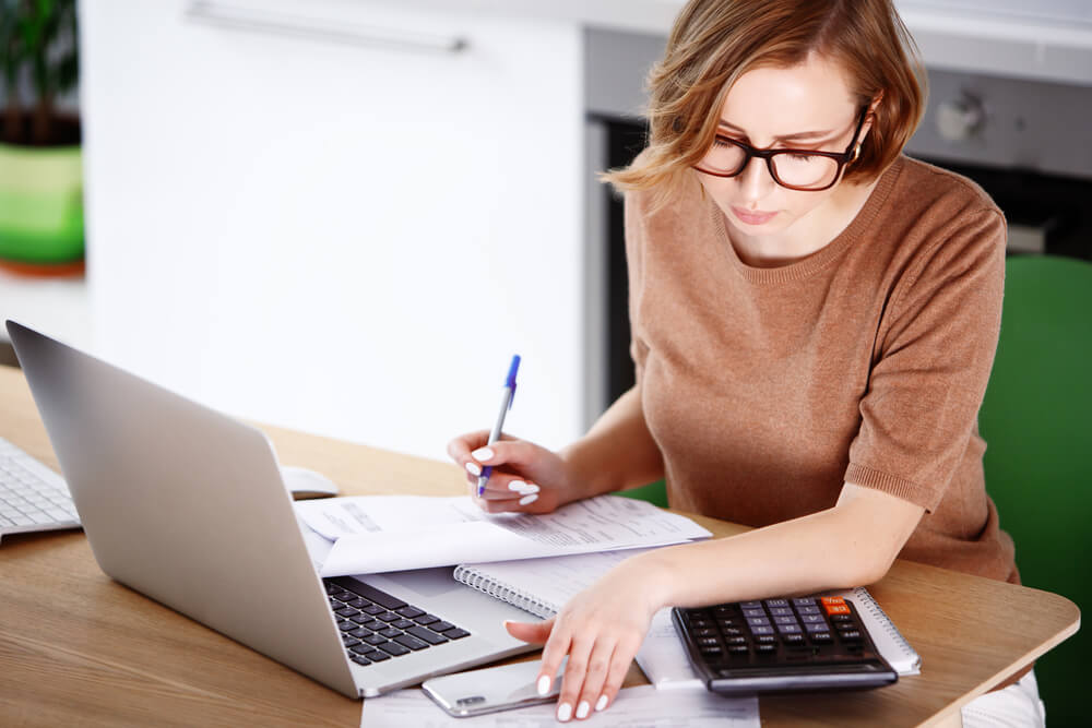 woman calculating her debt