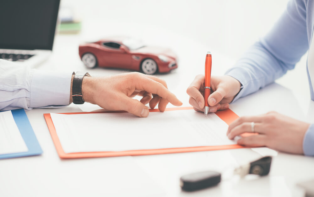 person signing a loan with car title 