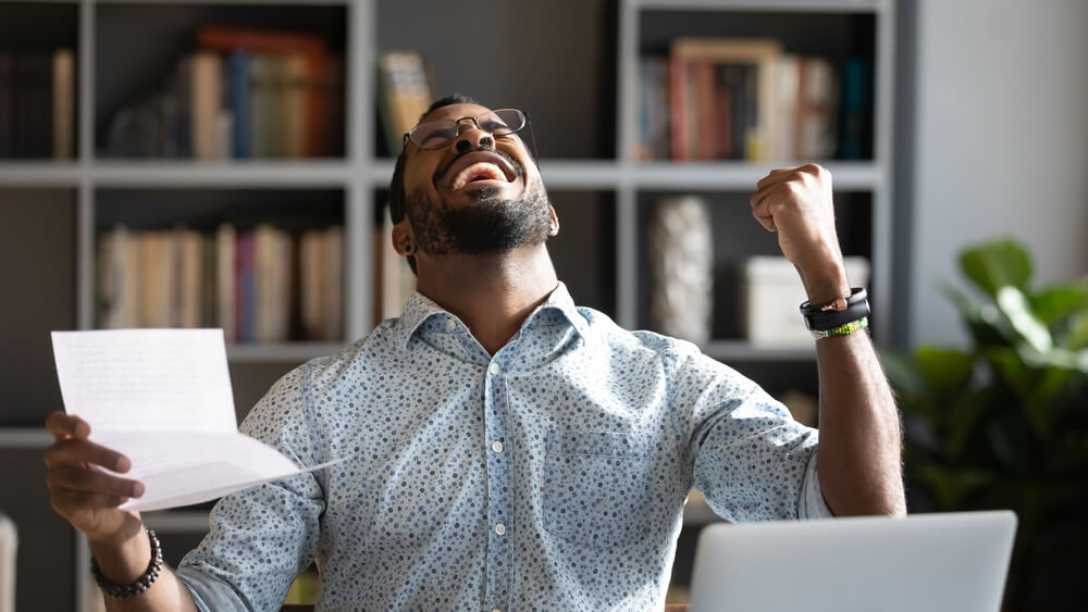 man celebrates after building credit fast