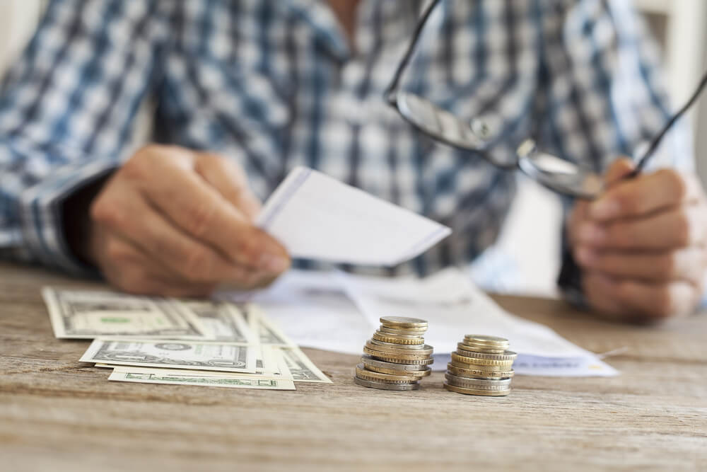 man signs a payday loan application