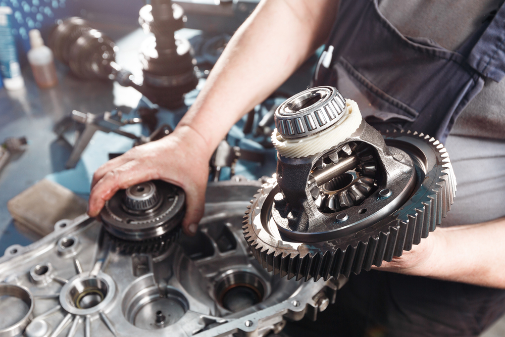 person working on transmission repair