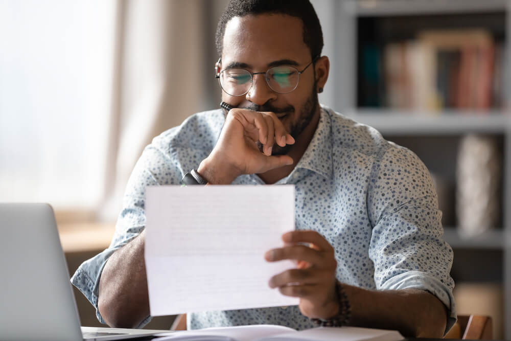 black man smiles learning about personal finance