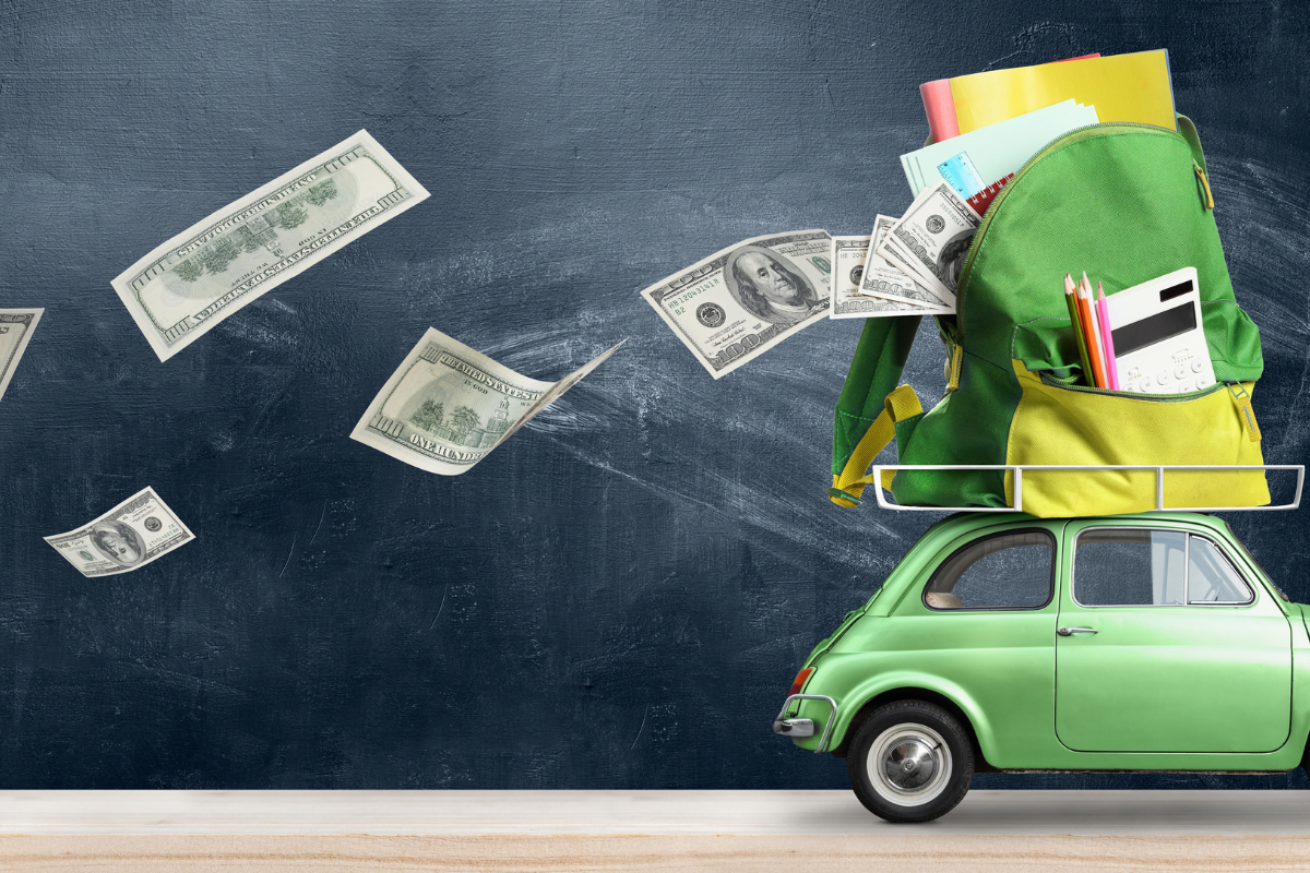 school supplies on top car and money blowing away