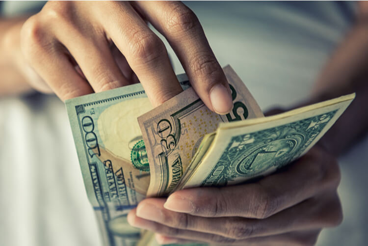 woman counting title pawn cash