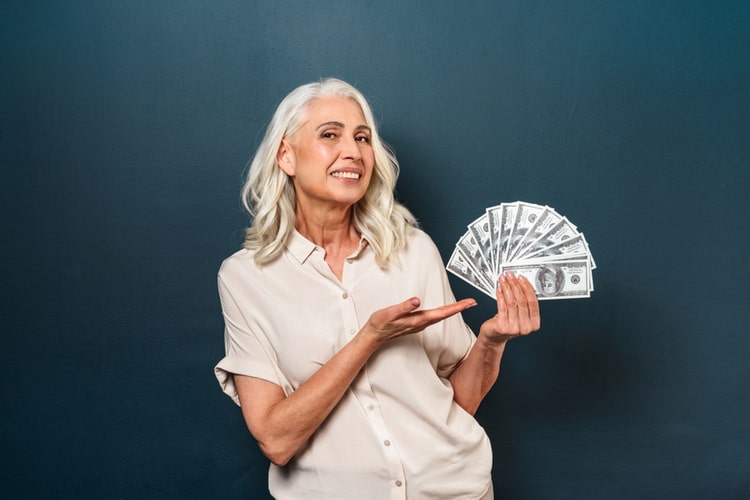 woman holding title cash