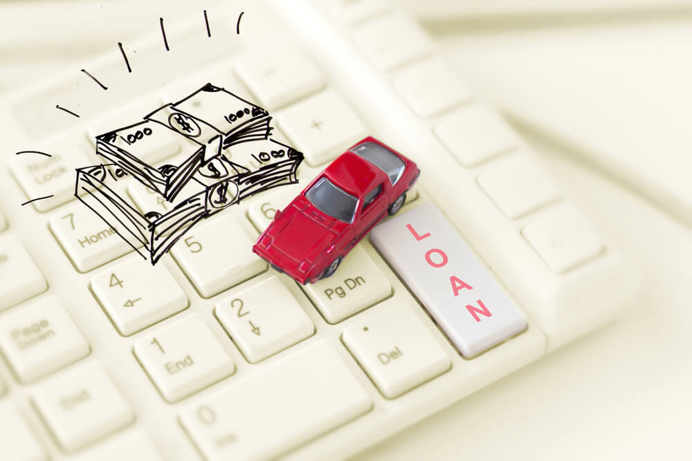 car title loan and money on keyboard