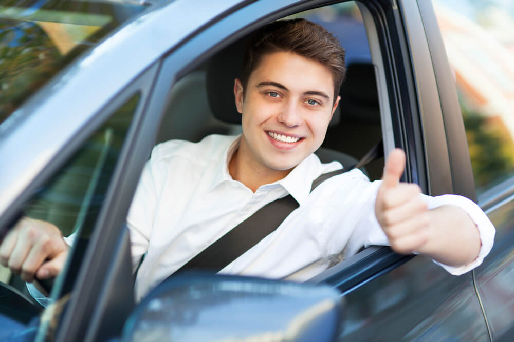 Man with thumbs up leaving title pawn location from getting approved