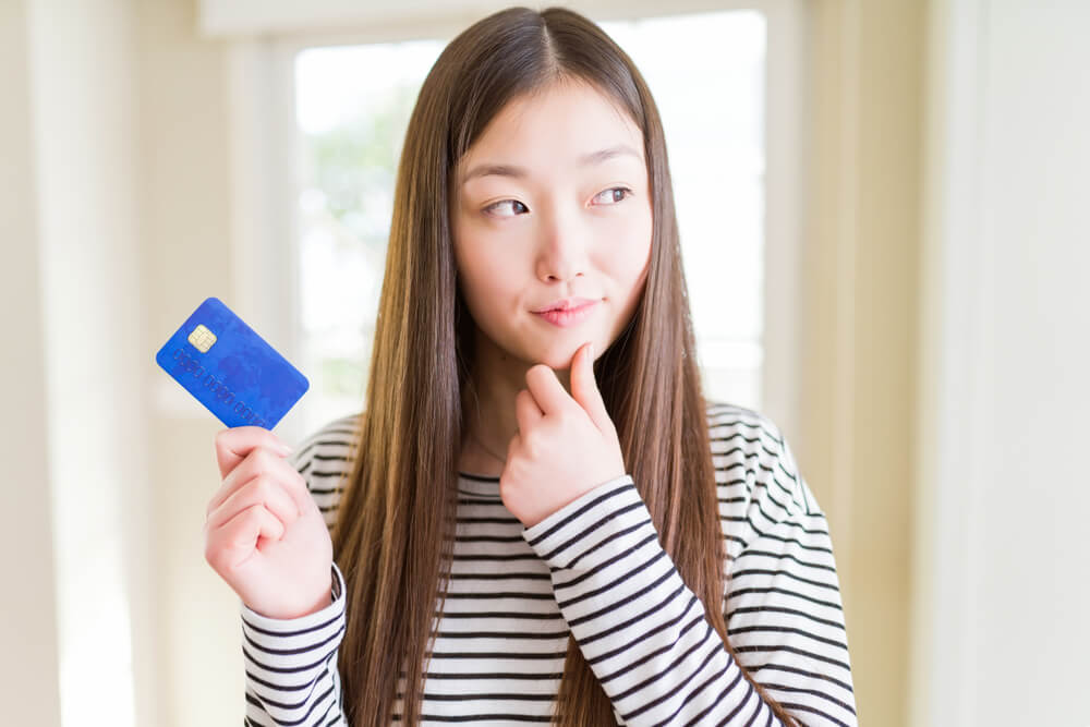 woman thinking about investing money