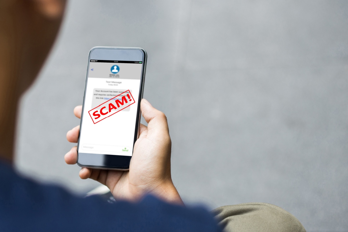 person looking to avoid loan scams on phone