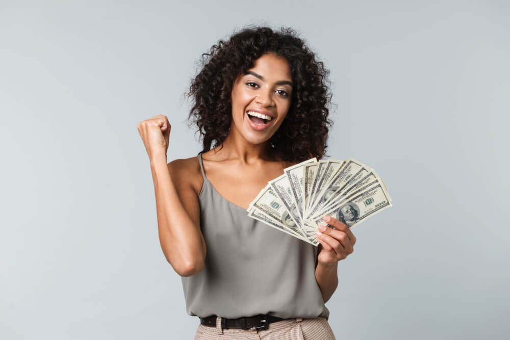 woman happy from payday loan cash