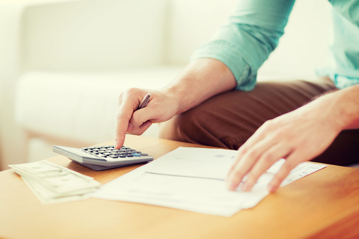 woman working on her budget for car title loan