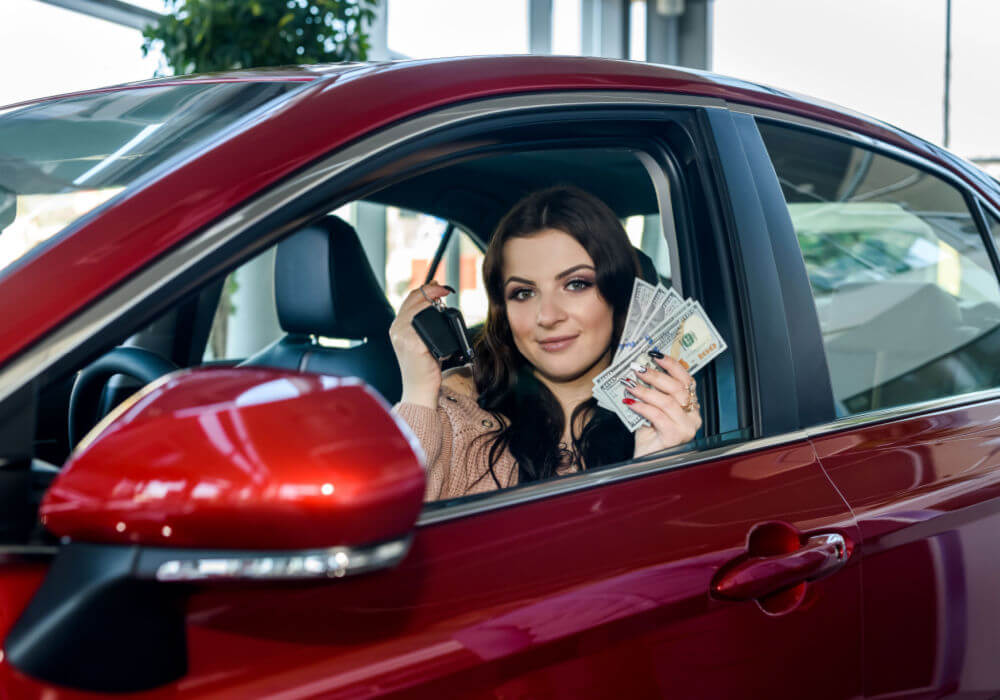 woman in car with title loan cash