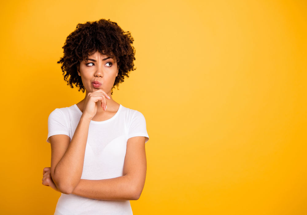 woman thinking about getting paycheck advance