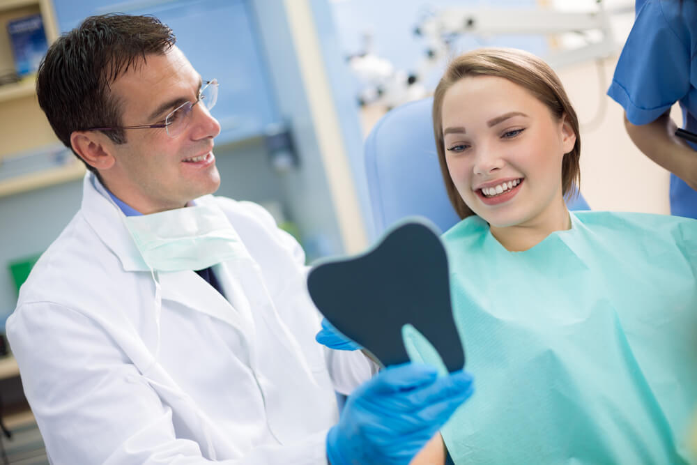 woman learning about dental payment options