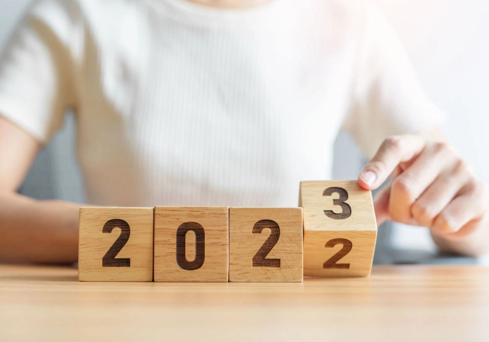 A man turns over a block to represent year-end personal financial planning.