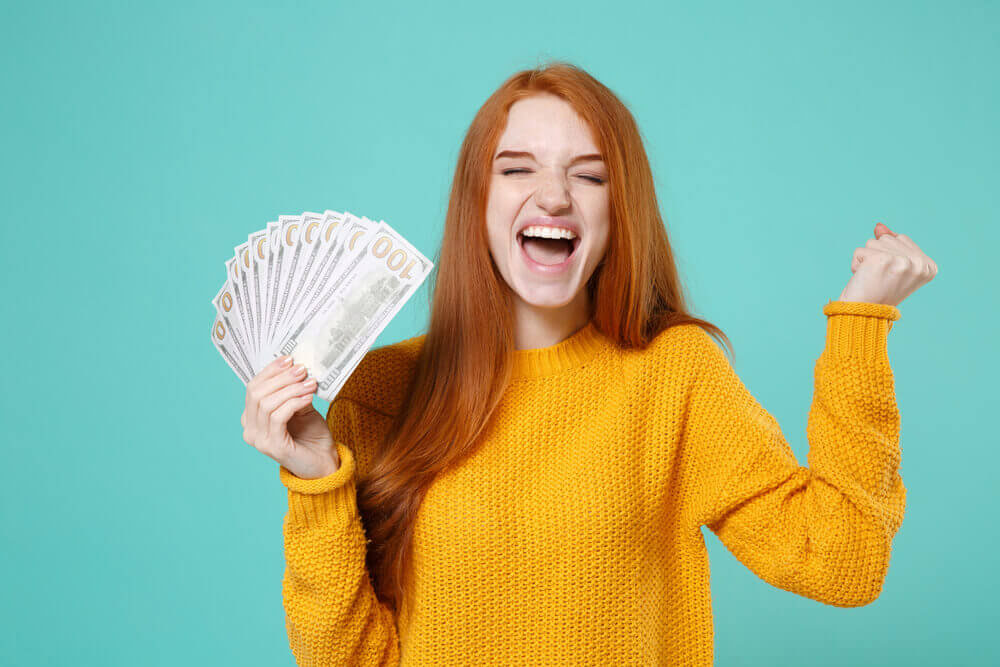 woman happy about payday loan money