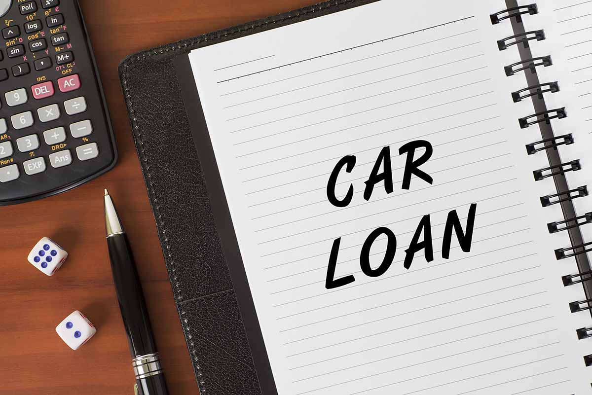 car loan written in notebook