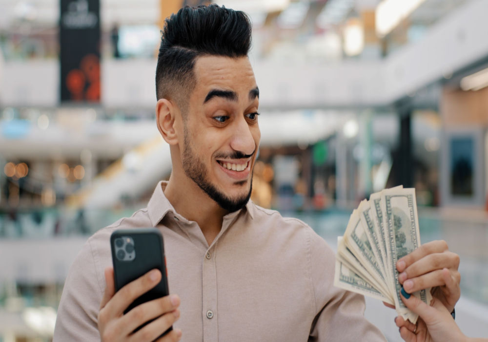 man excited about emergency installment loan money