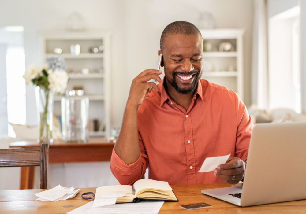 man happy while speaking with Title Loan representative