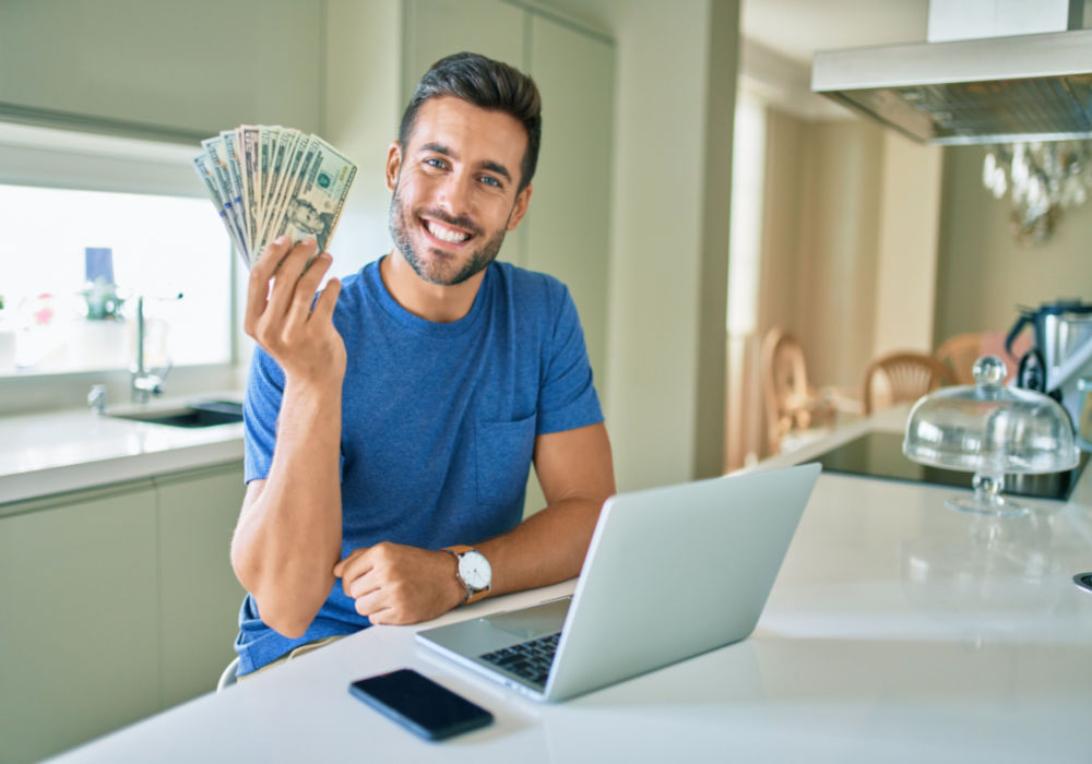 man with money from paycheck advance