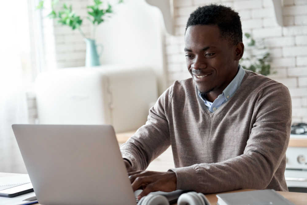 man in his kitchen applying for online title pawn