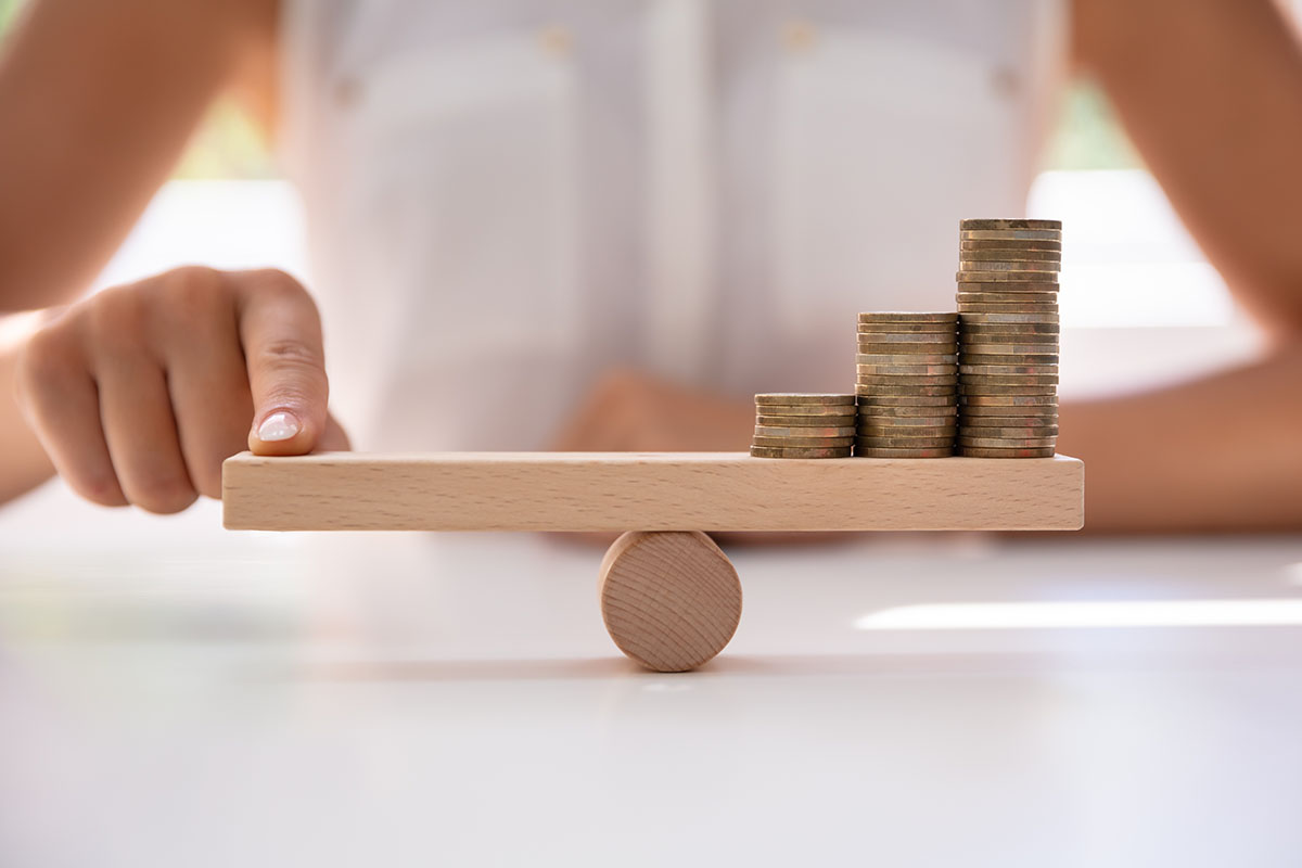 person balancing their money