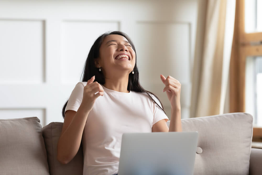 woman happy to know the benefits of title loans in New Mexico