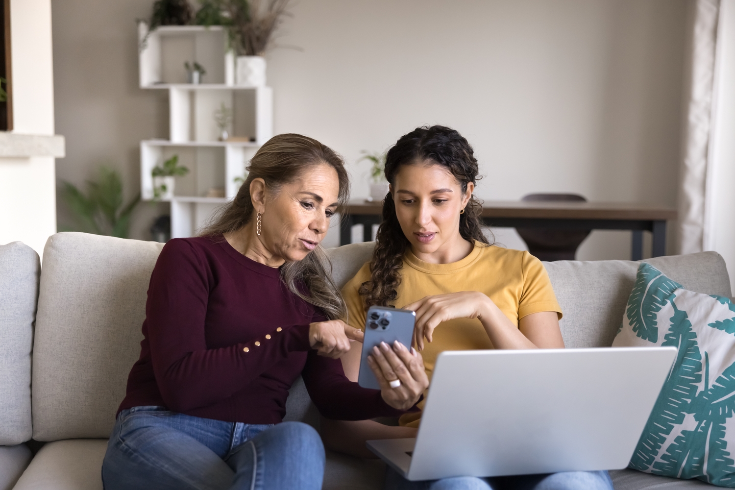Mother and daughter researching on phone