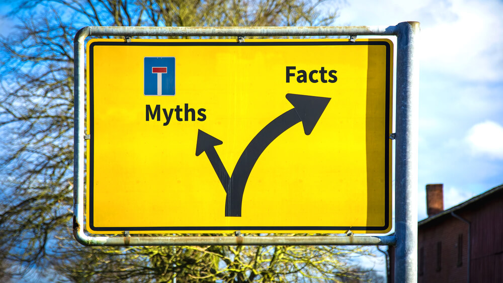 Yellow road sign about myths of title pawning