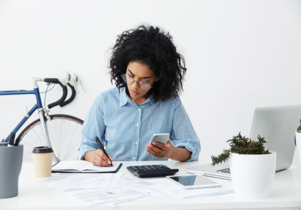 woman working on her weekly budget