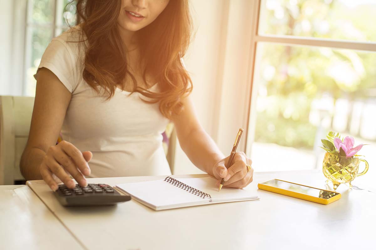 immigrant woman working on budget